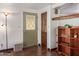 Inviting entryway with a charming wood door and storage at 205 S Higley Rd # 189, Mesa, AZ 85206