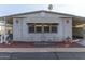 Neatly landscaped manufactured home with covered entryway at 205 S Higley Rd # 189, Mesa, AZ 85206