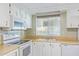 Efficient kitchen with white appliances and wood counters at 205 S Higley Rd # 189, Mesa, AZ 85206