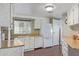 Well-equipped kitchen with white cabinets and wood countertops at 205 S Higley Rd # 189, Mesa, AZ 85206