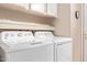 Laundry room with washer, dryer, and cabinets at 205 S Higley Rd # 189, Mesa, AZ 85206