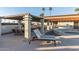 Relaxing poolside patio with tables, chairs, and grill at 205 S Higley Rd # 189, Mesa, AZ 85206