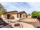 Backyard patio featuring a firepit, desert landscaping, and a covered patio at 2077 W Tanner Ranch Rd, San Tan Valley, AZ 85144