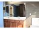 Double vanity bathroom with a large mirror and light wood cabinets at 2077 W Tanner Ranch Rd, San Tan Valley, AZ 85144