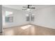 Bright bedroom with neutral walls, tile flooring, and a ceiling fan at 2077 W Tanner Ranch Rd, San Tan Valley, AZ 85144