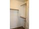 Closet with hanging rods and shelving units at 2077 W Tanner Ranch Rd, San Tan Valley, AZ 85144