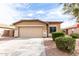 Charming single-story home featuring a two-car garage, well-maintained landscaping, and a welcoming entrance at 2077 W Tanner Ranch Rd, San Tan Valley, AZ 85144