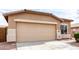 Charming single-story home featuring a two-car garage, well-maintained landscaping, and a welcoming entrance at 2077 W Tanner Ranch Rd, San Tan Valley, AZ 85144
