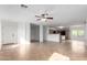 Spacious living area with neutral walls, tile flooring, ceiling fan, and abundant natural light at 2077 W Tanner Ranch Rd, San Tan Valley, AZ 85144