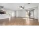 Expansive living area featuring tile floors, modern lighting, and open access to other spaces at 2077 W Tanner Ranch Rd, San Tan Valley, AZ 85144