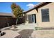 Small backyard patio with sliding glass doors at 2077 W Tanner Ranch Rd, San Tan Valley, AZ 85144