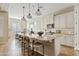 Modern kitchen with white cabinets and large island at 2867 E Citadel Ct, Gilbert, AZ 85298