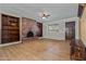 Living room with wood-look floors and built-in shelves at 3001 W Villa Maria Dr, Phoenix, AZ 85053