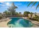 Relaxing kidney-shaped pool with ample patio space at 3001 W Villa Maria Dr, Phoenix, AZ 85053