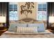 This bedroom has a headboard with decorative pillows and a tree art piece above it at 305 W Lewis Ave, Phoenix, AZ 85003