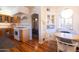 Bright kitchen with an attached breakfast nook featuring built-in seating and a round table at 305 W Lewis Ave, Phoenix, AZ 85003