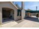 Side view of a charming home with a covered carport and manicured landscaping at 305 W Lewis Ave, Phoenix, AZ 85003