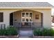 Cozy front porch with a seating area, perfect for relaxing and enjoying the outdoors at 305 W Lewis Ave, Phoenix, AZ 85003
