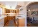 Bright kitchen features a oven, light wood cabinets, and a window with natural light at 305 W Lewis Ave, Phoenix, AZ 85003