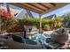 This spacious covered patio features comfortable seating and a tranquil view of the surrounding landscape at 305 W Lewis Ave, Phoenix, AZ 85003