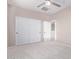 Bedroom with double door closet and access to another room at 32211 N Lepa Dr, San Tan Valley, AZ 85144