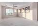 Spacious bedroom with carpeted floor, ceiling fan, and large window at 32211 N Lepa Dr, San Tan Valley, AZ 85144