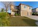 Two-story house with three car garage and landscaped lawn at 32211 N Lepa Dr, San Tan Valley, AZ 85144