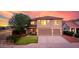 Charming two-story home featuring a well-maintained lawn, a two-car garage, and desert landscaping at 32211 N Lepa Dr, San Tan Valley, AZ 85144
