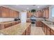 Spacious kitchen with island, stainless steel appliances, and granite countertops at 32211 N Lepa Dr, San Tan Valley, AZ 85144