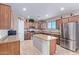 Spacious kitchen with island, stainless steel appliances, and granite countertops at 32211 N Lepa Dr, San Tan Valley, AZ 85144