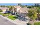 Two-story house with a large yard, palm trees, and a three-car garage at 3503 E Princeton Ct, Gilbert, AZ 85234