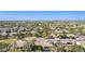 Aerial view of a residential neighborhood showcasing homes, a park, and mountain views at 3503 E Princeton Ct, Gilbert, AZ 85234