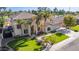 Two-story house with a large front yard, palm trees, and a circular driveway at 3503 E Princeton Ct, Gilbert, AZ 85234