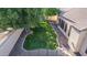 Landscaped backyard with a large grassy area and mature trees at 3503 E Princeton Ct, Gilbert, AZ 85234