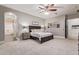 Serene bedroom with ensuite bathroom access and large windows at 3503 E Princeton Ct, Gilbert, AZ 85234