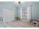 Charming bedroom with light blue walls, and a crib at 3503 E Princeton Ct, Gilbert, AZ 85234
