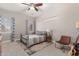 Spacious bedroom with a metal bed frame, carpet, and a guitar at 3503 E Princeton Ct, Gilbert, AZ 85234
