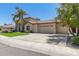 Two-story house with palm trees, a three-car garage, and a well-manicured lawn at 3503 E Princeton Ct, Gilbert, AZ 85234