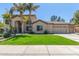 Two-story house with palm trees, a three-car garage, and a well-manicured lawn at 3503 E Princeton Ct, Gilbert, AZ 85234