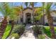 Landscaped front yard with palm trees and walkway leading to the entrance at 3503 E Princeton Ct, Gilbert, AZ 85234