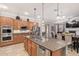 Gourmet kitchen boasts double ovens, large island with sink, and ample cabinetry at 3503 E Princeton Ct, Gilbert, AZ 85234
