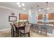 Eat-in kitchen with wood cabinets, granite counters, and decorative backsplash at 3503 E Princeton Ct, Gilbert, AZ 85234