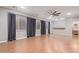 Spacious living room with hardwood floors and ceiling fan at 3503 E Princeton Ct, Gilbert, AZ 85234