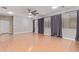 Large living area with hardwood floors and dark curtains at 3503 E Princeton Ct, Gilbert, AZ 85234