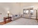Spacious living room with hardwood floors, two sofas, and a large window at 3503 E Princeton Ct, Gilbert, AZ 85234