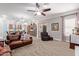 Spacious living room with leather couches and large windows at 3503 E Princeton Ct, Gilbert, AZ 85234
