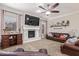 Relaxing living room featuring a fireplace and built-in shelving at 3503 E Princeton Ct, Gilbert, AZ 85234