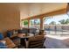Covered patio with seating, hot tub, and pool view at 3503 E Princeton Ct, Gilbert, AZ 85234