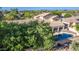 An aerial view of a large, rectangular pool and patio area in a backyard at 3503 E Princeton Ct, Gilbert, AZ 85234