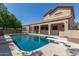 Stunning pool and spacious backyard with a view of the house at 3503 E Princeton Ct, Gilbert, AZ 85234